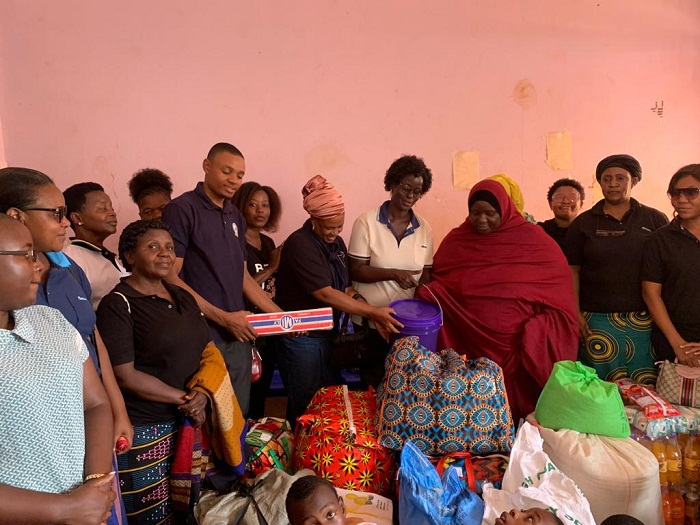 RAAWU leaders from TARI Dakawa centre and Morogoro region show sympathy as they stretch their arms to support children living under hardships at Raya Orphanage Foundation, Mvomero District, Morogoro celebrating Women's Day on March 08, 2022