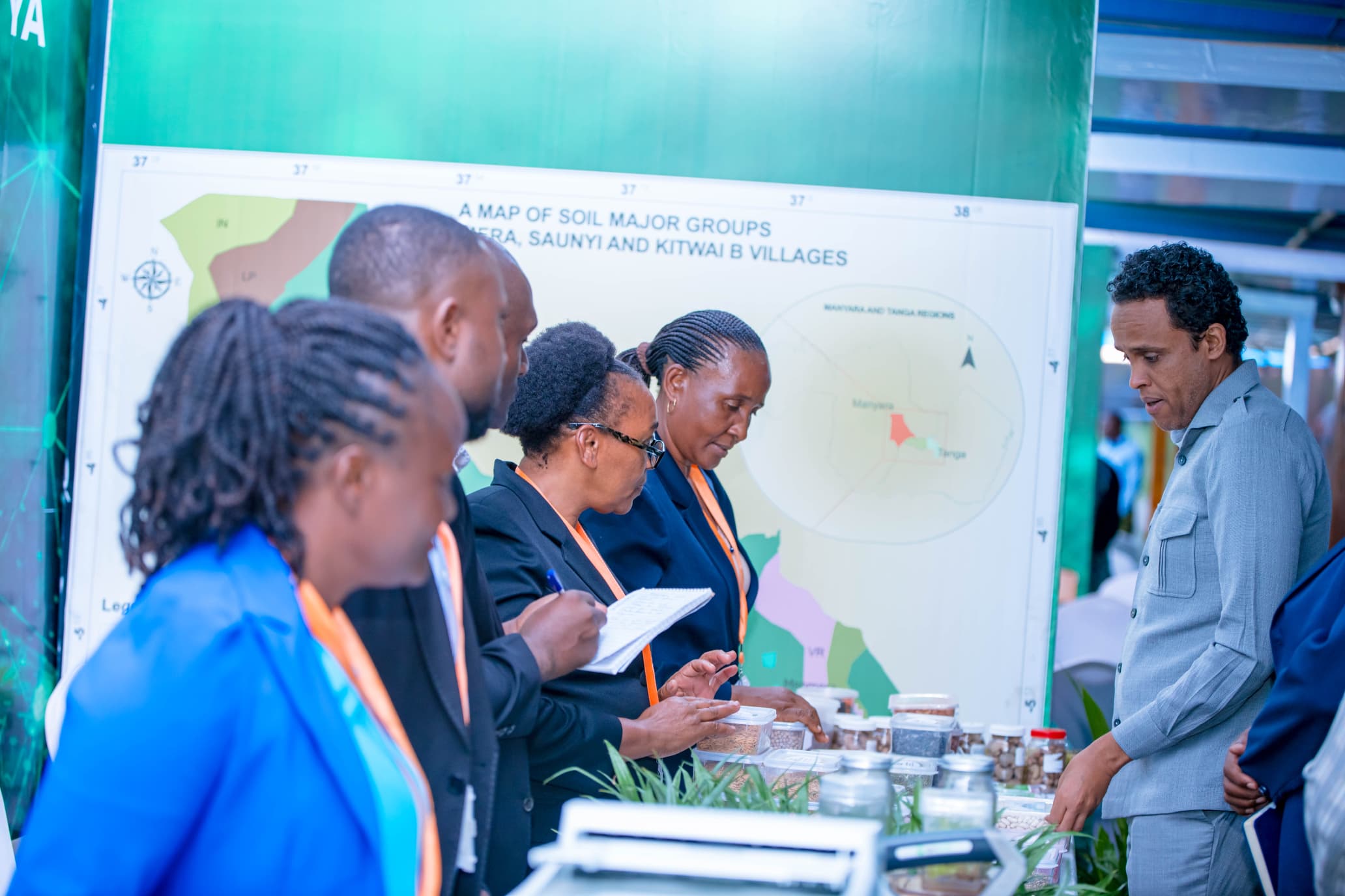 Minister of Agriculture Hon. Hussein Bashe receiving explanations on TARI Ilonga Seed technologies at the Ministry of Agriculture exhibition held at the Parliament grounds from 27/4/2024 to 3/5/2024. 