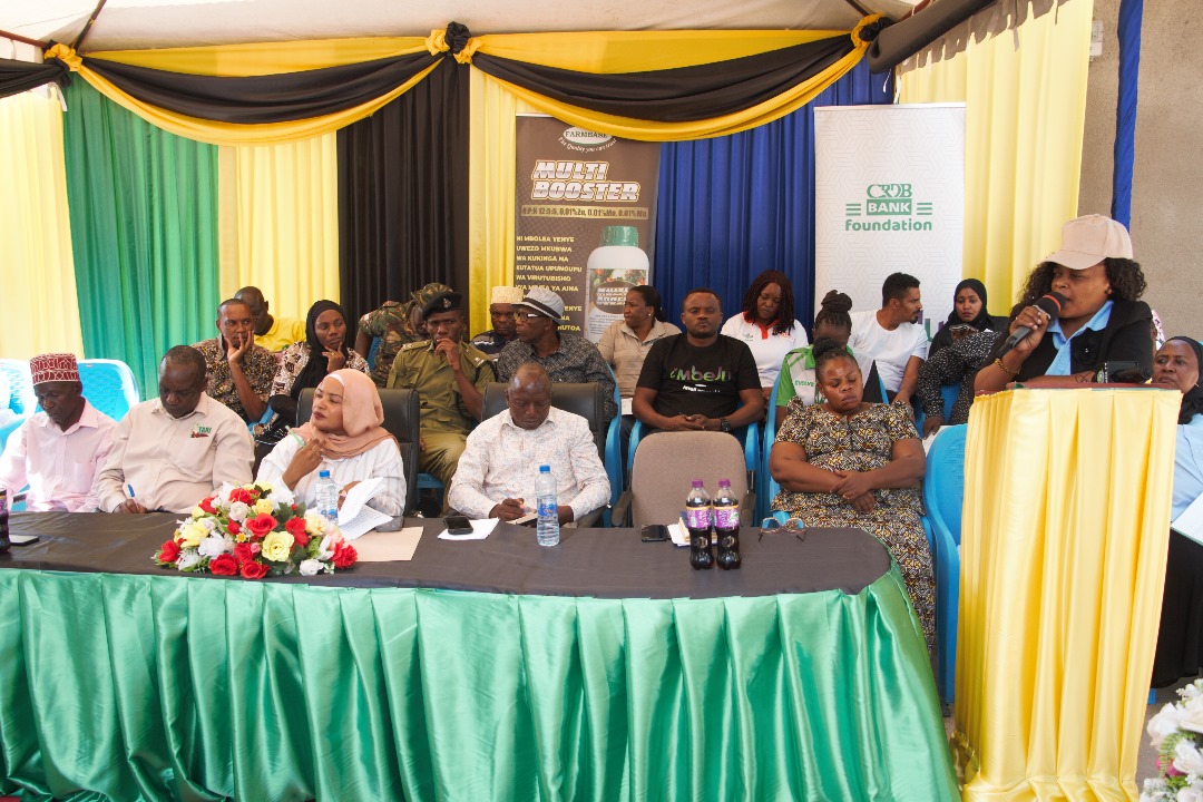 Dr. Geradina Mzena (Right), Director for Technology Transfer and Partnership from TARI Headquarters when giving a briefly on Coconut farming research activities at Mkuranga during Farmer Field Day (FFD) before welcoming Hon. Khadija Nassir, Mkuranga Distr